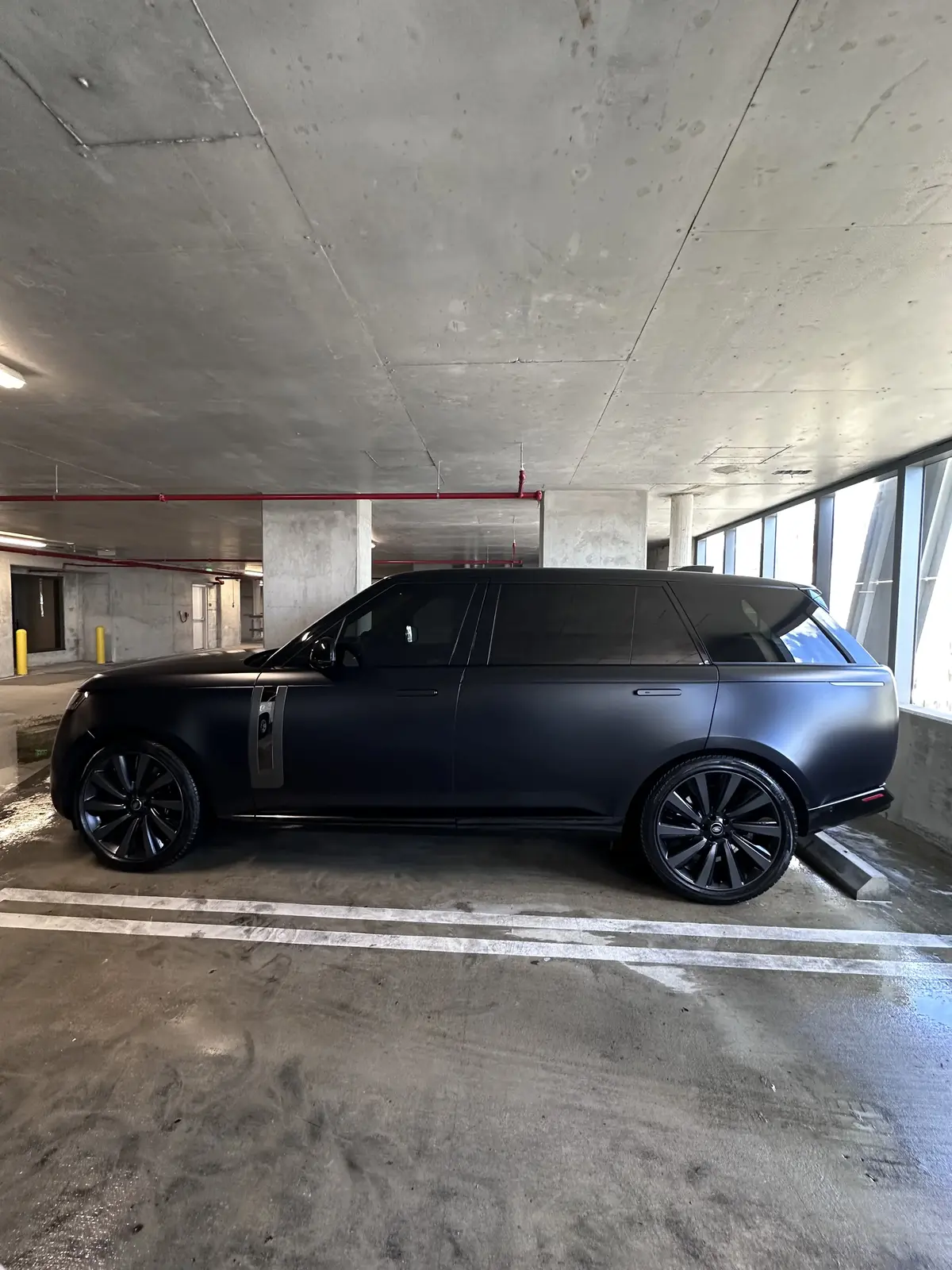 Matte black Range Rover side profile showing flawless matte finish after detailing