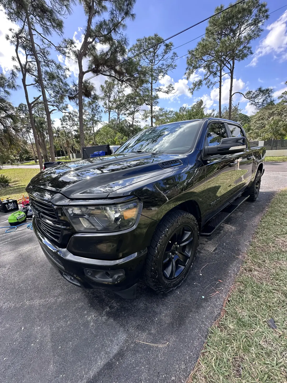 Black RAM 1500 truck front view after premium detail in Palm Beach County